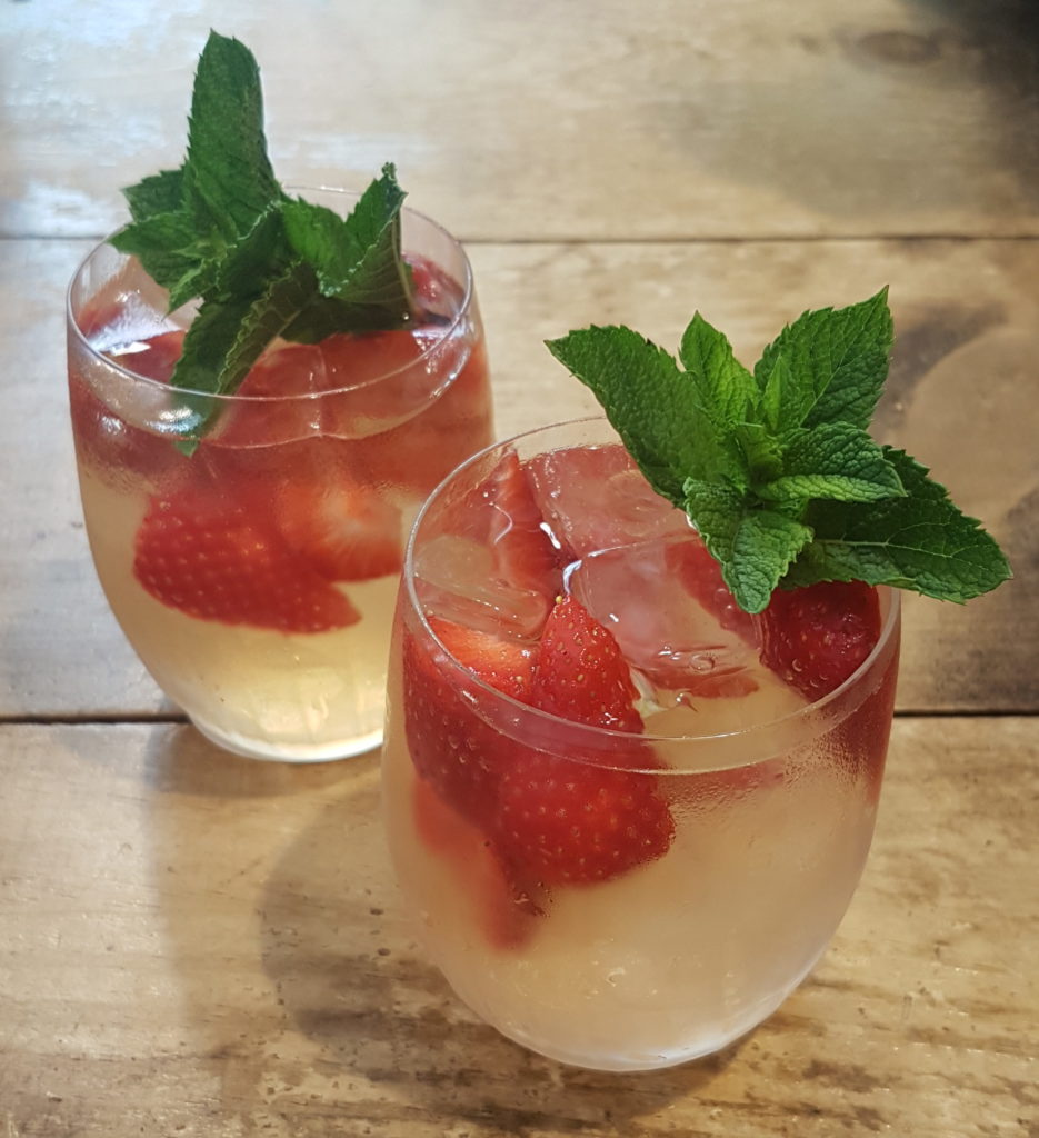 two glasses of strawberry and champagne iced tea